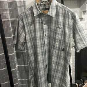 Patagonia button up shirt . Plaid print with pocket. Ptp 24 .
